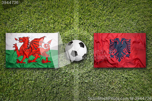 Image of Wales vs. Albania flags on soccer field