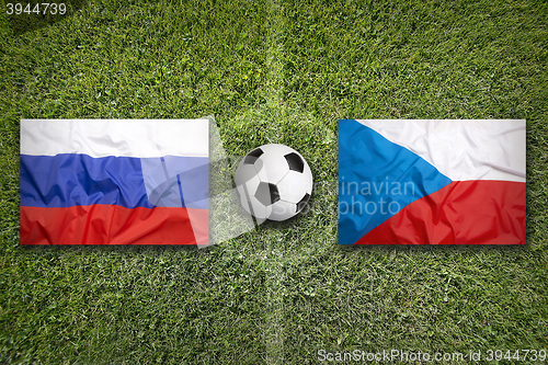 Image of Russia vs. Czech Republic flags on soccer field