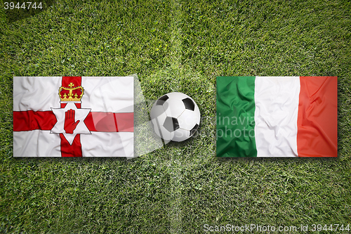 Image of Northern Ireland vs. Italy flags on soccer field