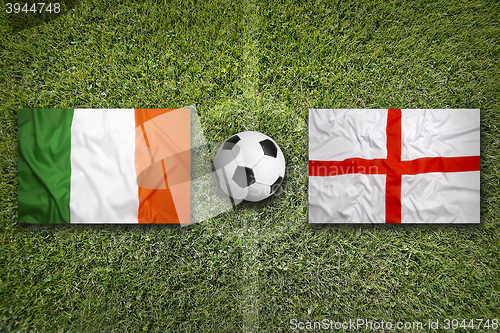 Image of Ireland vs. England flags on soccer field