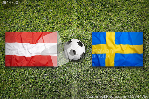 Image of Austria vs. Sweden flags on soccer field