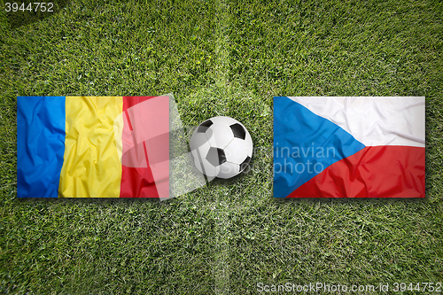 Image of Romania vs. Czech Republic flags on soccer field