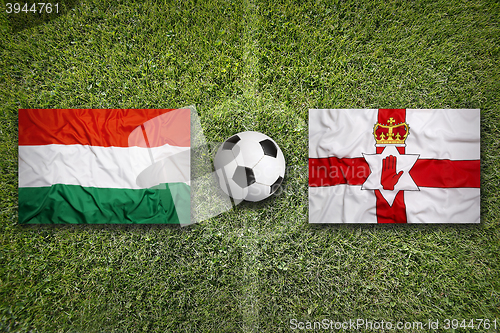 Image of Hungary vs. Northern Ireland flags on soccer field