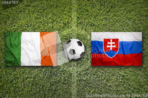 Image of Ireland vs. Slovakia flags on soccer field