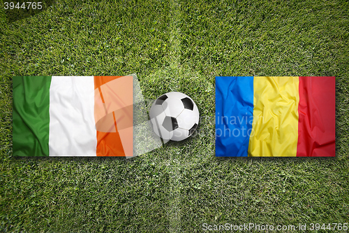 Image of Ireland vs. Romania flags on soccer field