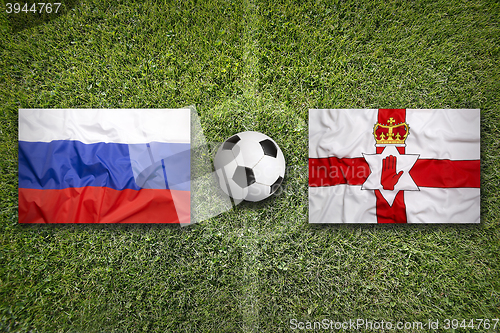 Image of Russia vs. Northern Ireland flags on soccer field