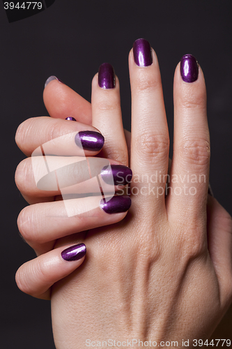 Image of Close up of female hands over black