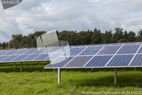 Image of Field with blue siliciom solar cells alternative energy