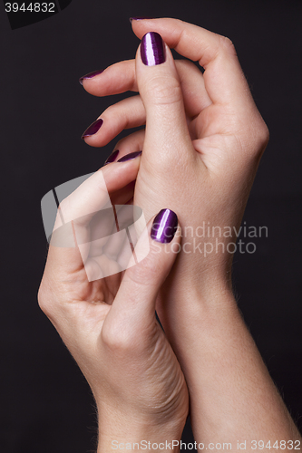 Image of Close up of female hands over black