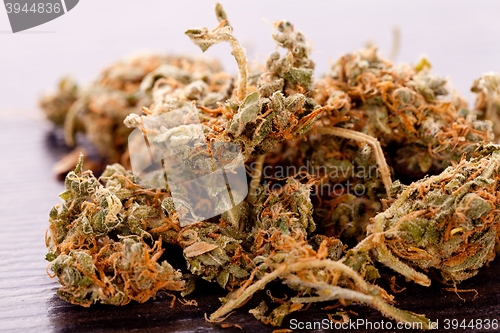 Image of Close up Dried Marijuana Leaves on the Table