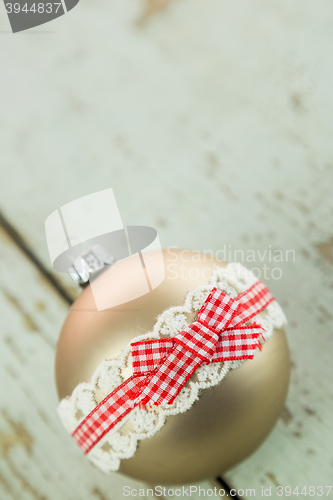 Image of Three Christmas baubles on rustic wood