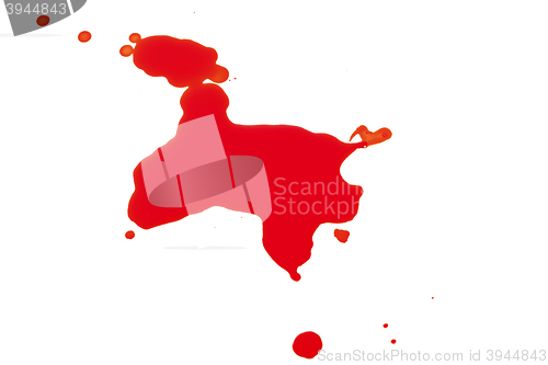 Image of Syringe Squirting Red Blood onto White Background