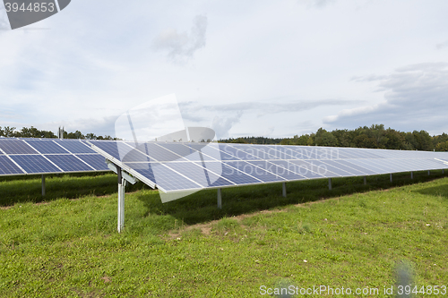 Image of Field with blue siliciom solar cells alternative energy