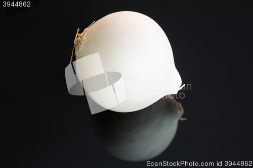 Image of Three whole fresh raw white onions