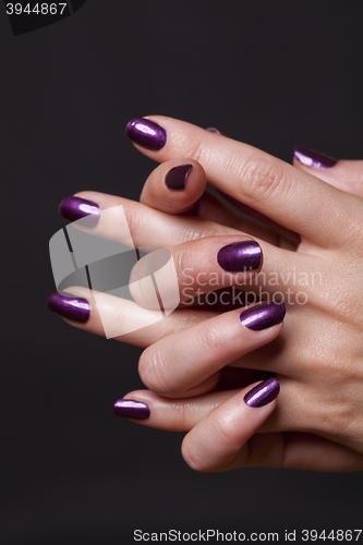 Image of Close up of female hands over black