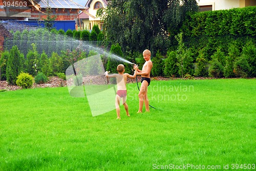 Image of boys play on the grass