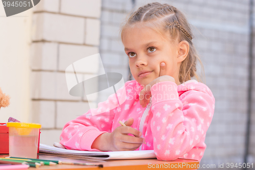 Image of Schoolgirl thought drawing on the album in pencil, in the yard