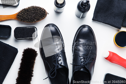 Image of Cleaning boots concept on white background