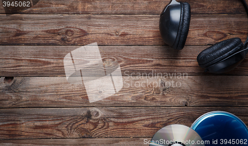 Image of top view of music cd player equipment on wooden desk