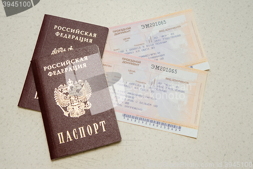 Image of Volgograd, Russia - August 12, 2015: Two passport of the citizen of the Russian Federation and two tickets on a train