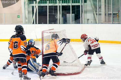 Image of Game between children ice-hockey teams