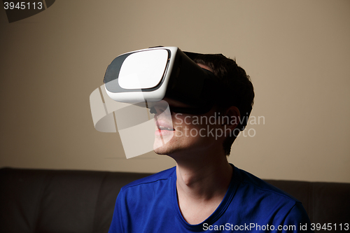 Image of Man wearing virtual reality goggles.