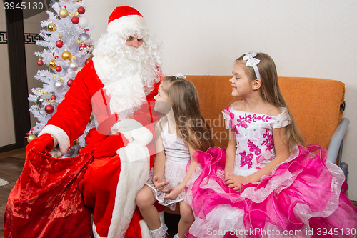 Image of The girls looked at the bag drop frost grandfather waiting for gifts