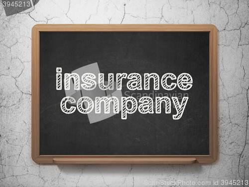 Image of Insurance concept: Insurance Company on chalkboard background