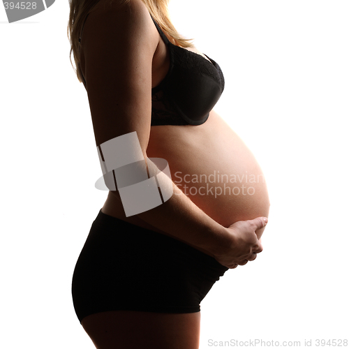 Image of Pregnant belly isolated against white background