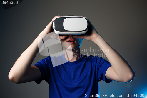 Image of Man wearing virtual reality goggles.