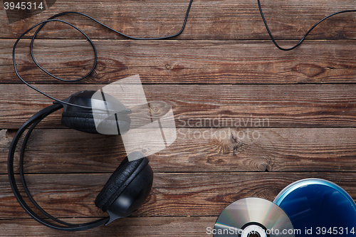 Image of top view of music cd player equipment on wooden desk