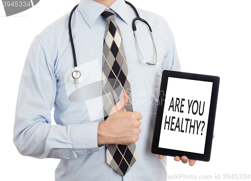 Image of Doctor holding tablet - Are you healthy?