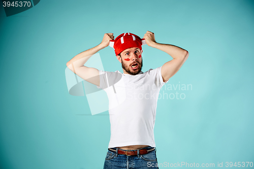 Image of The face of football fan with different emotions on blue