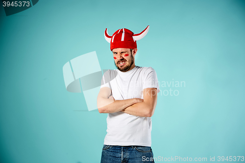 Image of The face of football fan with different emotions on blue
