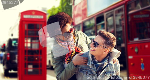 Image of happy teenage couple having fun in london city