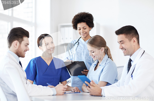 Image of group of happy doctors meeting at hospital office