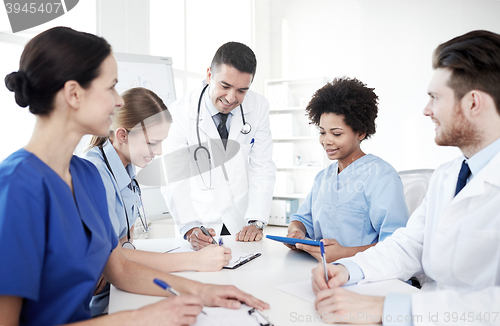 Image of group of happy doctors meeting at hospital office