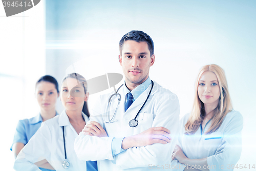 Image of male doctor in front of medical group