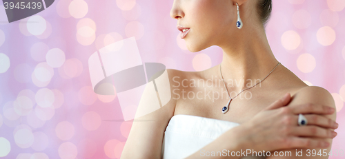 Image of beautiful woman with earring, ring and pendant