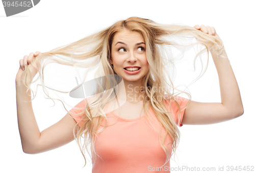 Image of woman holding strand of her hair