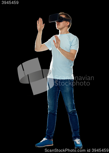 Image of happy man in virtual reality headset or 3d glasses