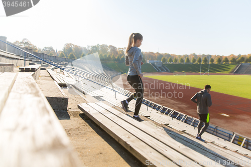 Image of couple running downstairs on stadium