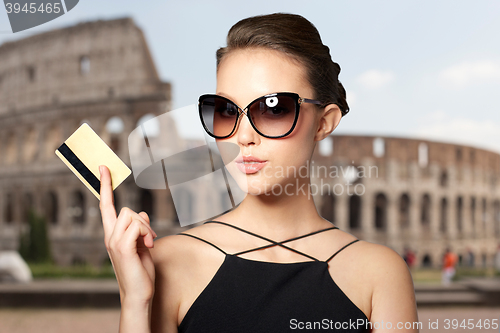 Image of beautiful young woman in elegant black sunglasses