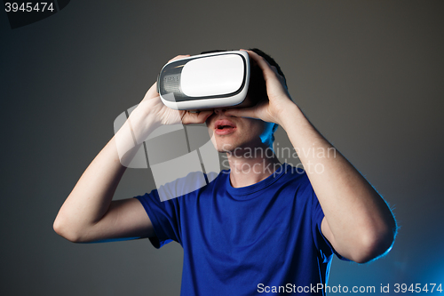 Image of Man wearing virtual reality goggles.