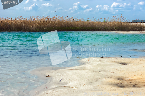 Image of Landscape with reed island in the turquoise lake