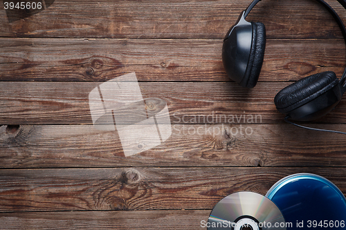 Image of top view of music cd player equipment on wooden desk