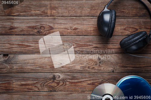 Image of top view of music cd player equipment on wooden desk