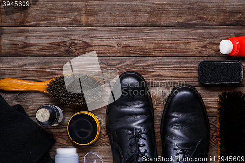Image of Shoe wax, brush and boot
