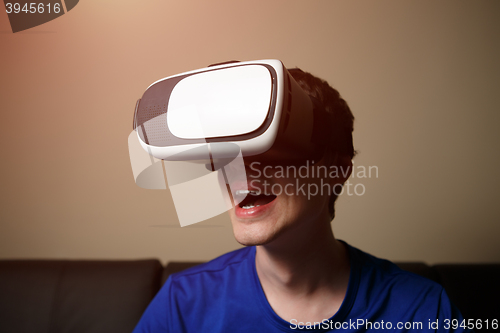 Image of Man wearing virtual reality goggles.