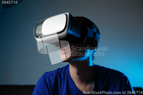 Image of Man wearing virtual reality goggles.